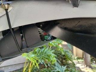 charger tucked under the back fender.jpg charger tucked under the back fender.jpg