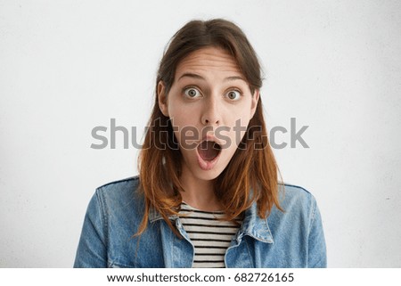 stock-photo-cute-female-model-looking-with-bugged-eyes-and-widely-opened-mouth-at-camera-being-astonished-of-682726165.jpg